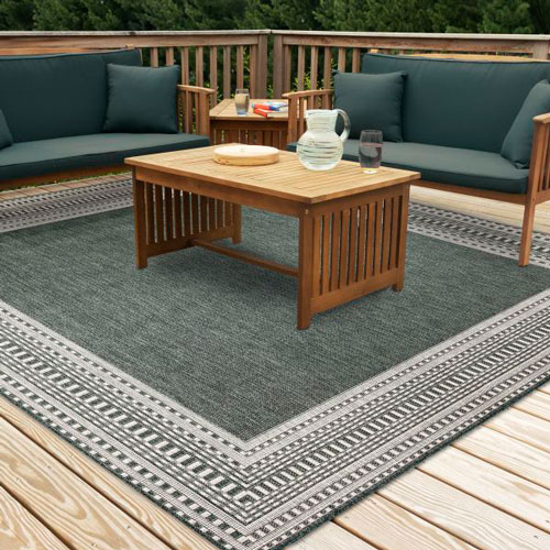 area rug outdoors to define patio seating area