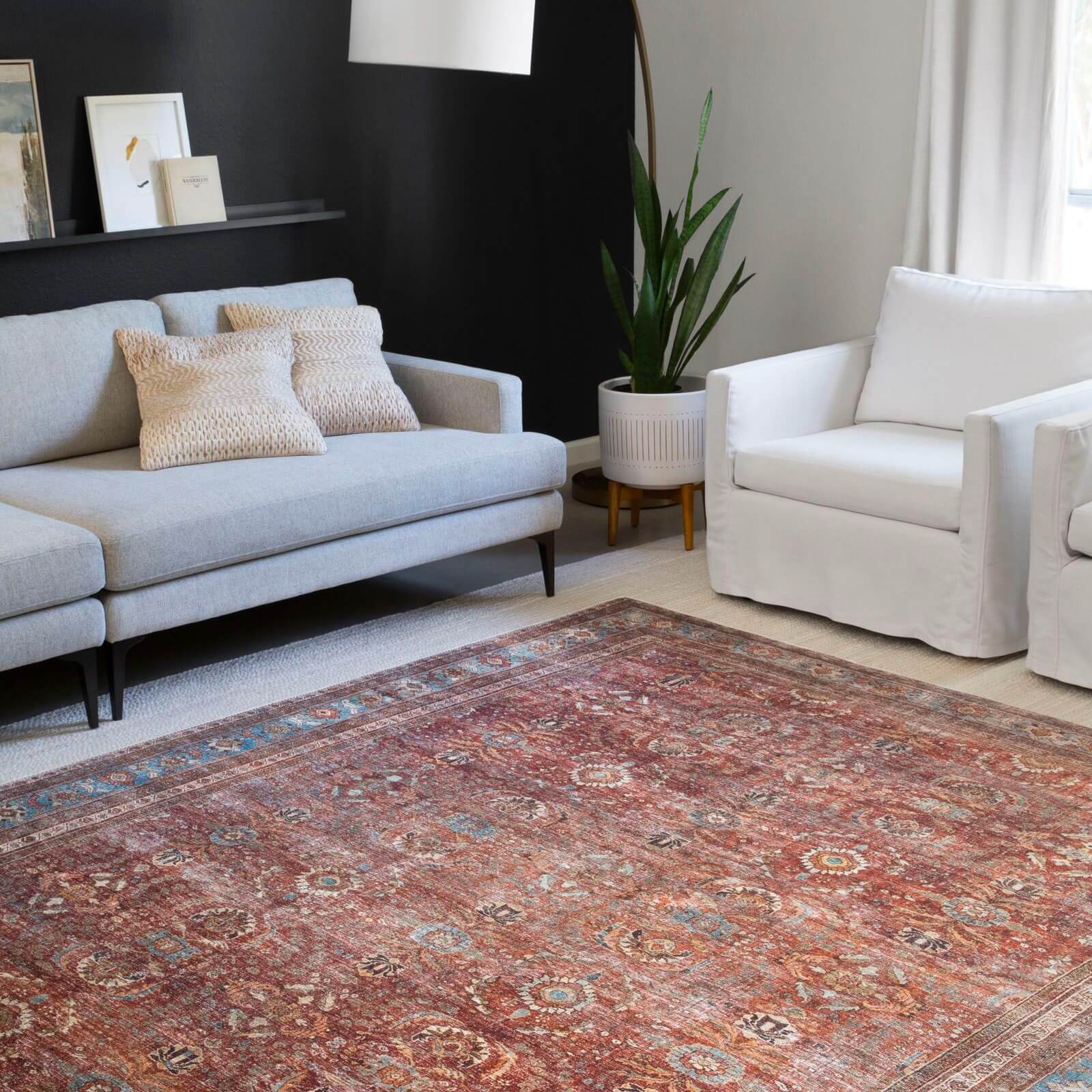 colorful patterned rug in living room that contrasts with furniture  