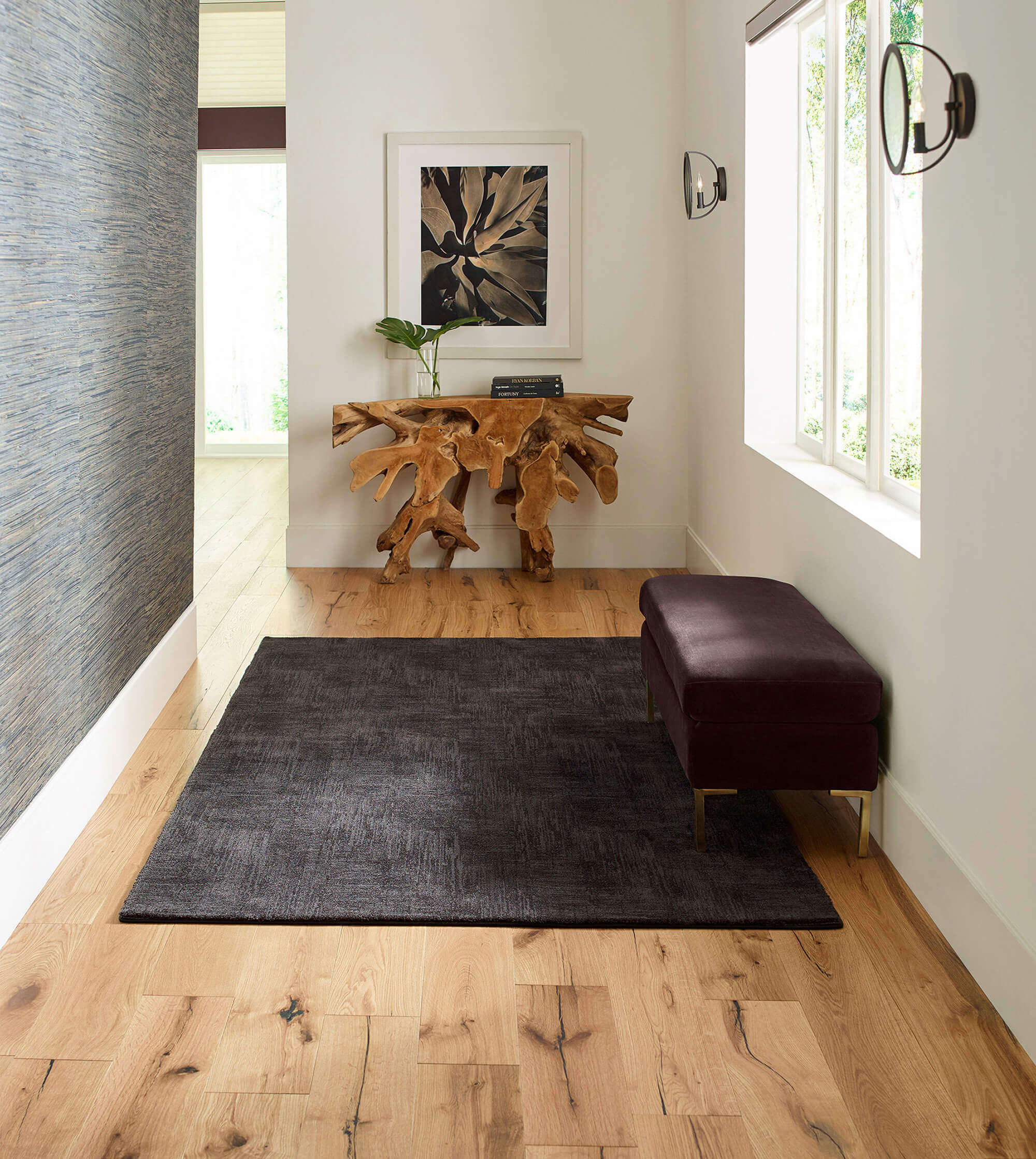 dark colored area rug in a nook of a home 