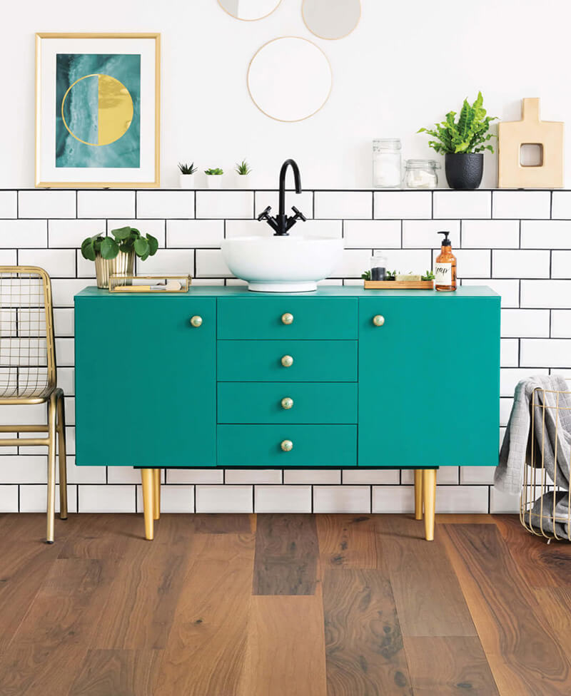 hardwood flooring and tile wall in a retro-inspired bathroom 