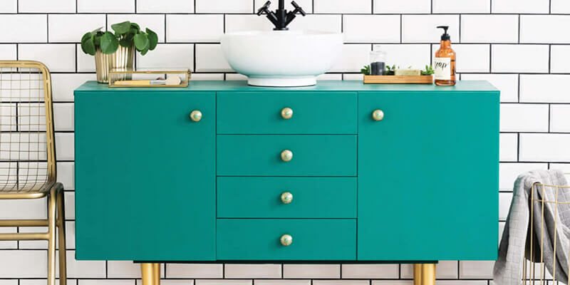 hardwood flooring and tile wall in a retro-inspired bathroom